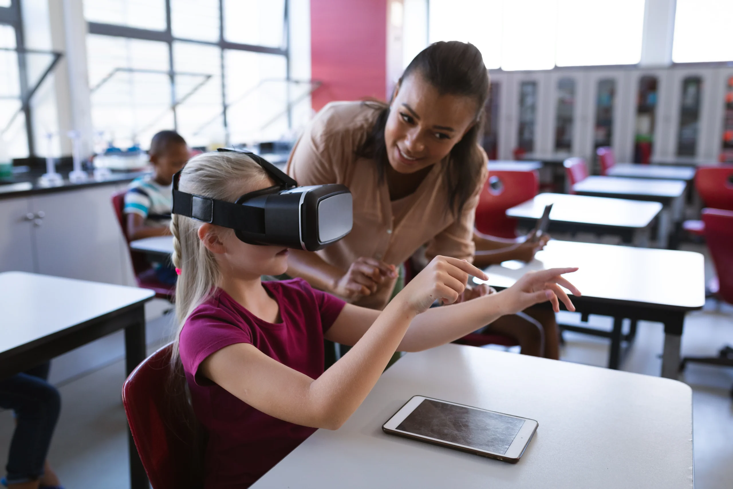 Side view portrait of little girl wearing VR headset in class and enjoying futuristic learning technology.